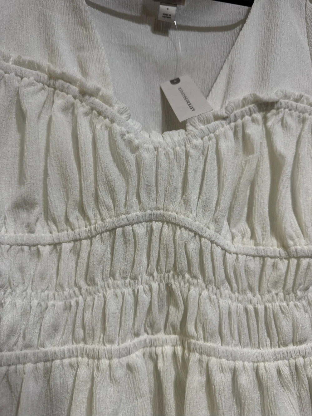 Anthropologie Cream Smocked Peplum Long-Sleeve Blouse